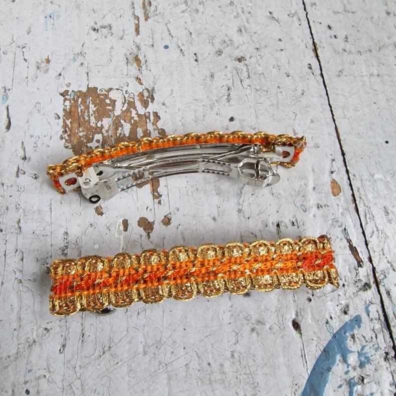 Orange hrpynt med 6 cm spnde