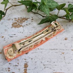 Fersken/rosa hrpynt med 10 cm spnde No.27