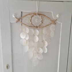 Drmmefanger det tredie je med skaller og vindspils effekt