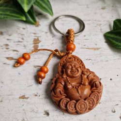 N�glering med Smilende Buddha � symbol p� gl�de og velstand
