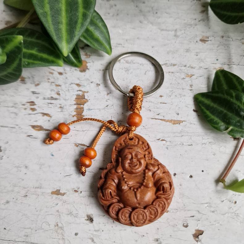 N�glering med Smilende Buddha � symbol p� gl�de og velstand