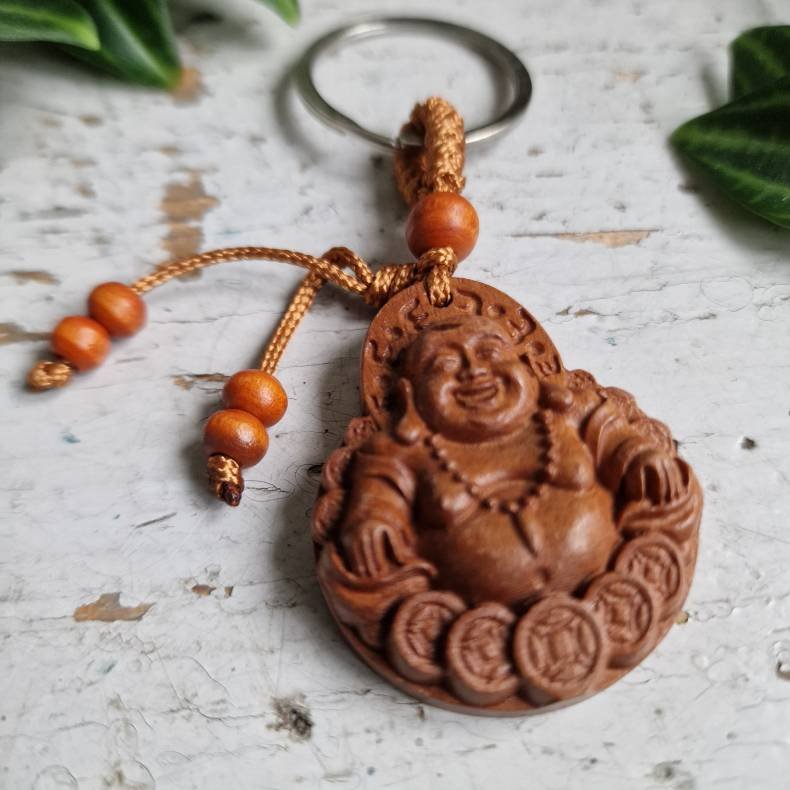 N�glering med Smilende Buddha � symbol p� gl�de og velstand