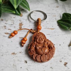 N�glering med Smilende Buddha � symbol p� gl�de og velstand