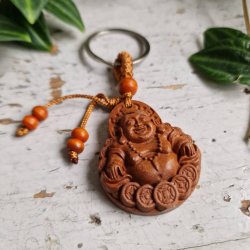 N�glering med Smilende Buddha � symbol p� gl�de og velstand