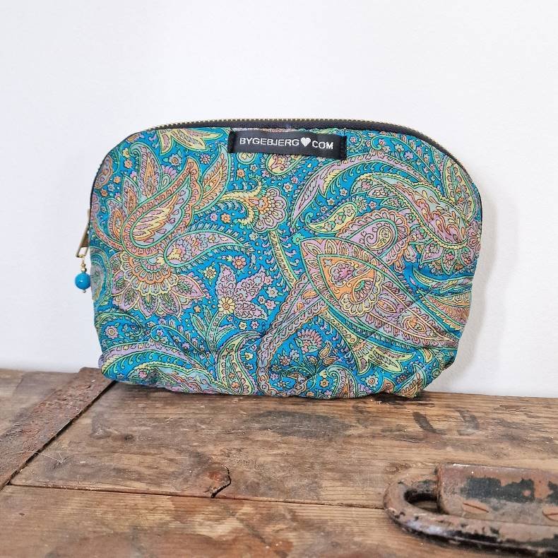 Silke kosmetikpung i varm turkis